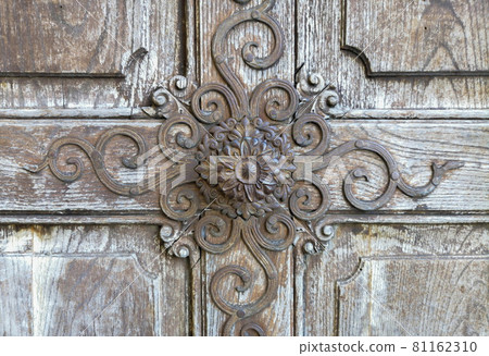 Detail of a beautiful old wooden door of Church Maria Strassengel, a 14th century Gothic pilgrimage church in the town of Judendorf Strassengel near Graz, Styria region, Austria 81162310