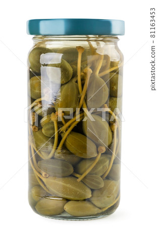 Pickled capers in a jar on a white background. Isolated Pickled capers in a jar on a white background. Isolated 81163453