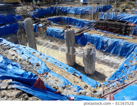 JOHOR, MALAYSIA -JUNE 28, 2016: Excavated bore pile at the construction site. Ready to cut the bore pile follow the design level. JOHOR, MALAYSIA -JUNE 28, 2016: Excavated bore pile at the construction site. Ready to cut the bore pile follow the design level. 81163528