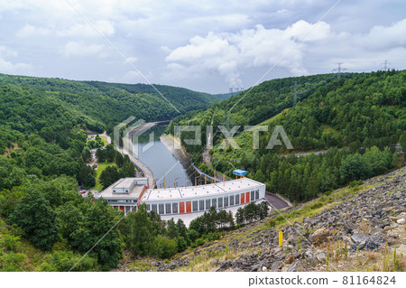 Dalesice Hydro Power Plant on the Jihlava River and in the background the cooling towers of nuclear power plants Dukovany, Trebic District, Czech republic, Europe. 81164824