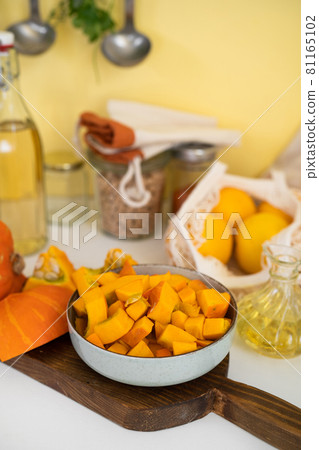 A plate with raw pumpkin pieces A plate with raw pumpkin pieces 81165102