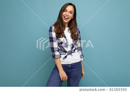 Photo portrait of young beautiful smiling hipster brunette woman in trendy blue and white shirt and Photo portrait of young beautiful smiling hipster brunette woman in trendy blue and white shirt and 81165593