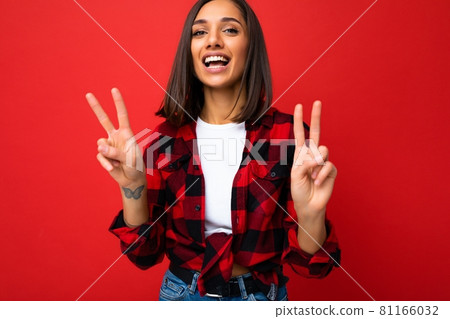 Young happy positive cool beautiful brunette woman with sincere emotions wearing white t-shirt and 81166032