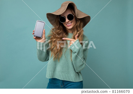 Photo of beautiful smiling young woman good looking wearing casual stylish outfit standing isolated 81166070