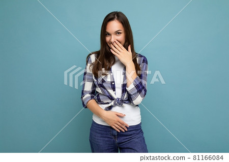Young positive happy beautiful winsom brunette woman with sincere emotions wearing check shirt 81166084
