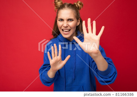 Photo of emotional angry young beautiful nice blonde woman with two horns with sincere emotions 81166386