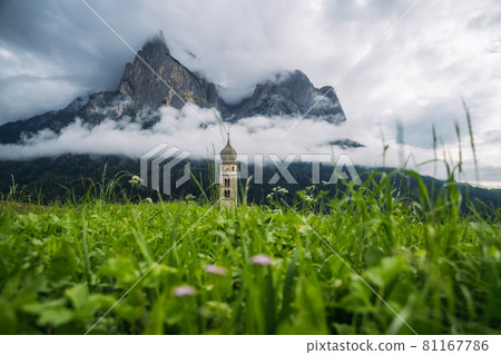 St Valentine's Church, Seis am Schlern, Italy. Schlern mountain with rainy clouds in background 81167786