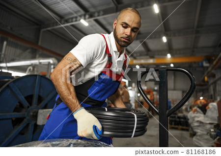 Portrait of african american male handyman working in an industrial factory 81168186