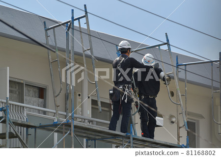 Large-scale condominium repair work scene at scaffolding dismantling site 81168802