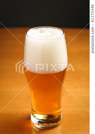 Beer poured into a glass Beer poured into a glass 81173346