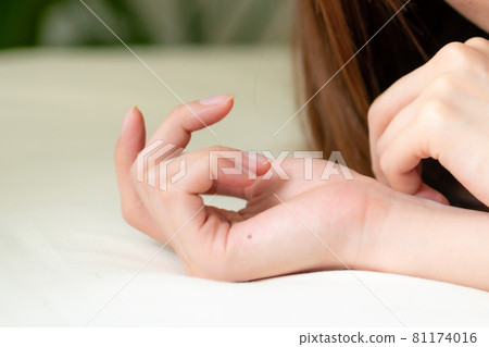 Image of a young woman lying on the bed Image of a young woman lying on the bed 81174016