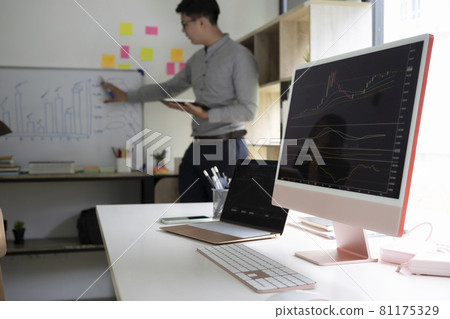 Desktop computer shows company growth data with graphs in modern office. Desktop computer shows company growth data with graphs in modern office. 81175329