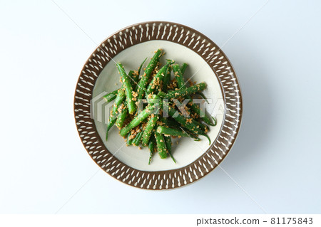 Green beans with sesame sauce on a white background 81175843