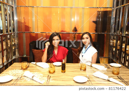 LGBTQIA+ two women have Lunch in restaurant on Dating. 20s young Lovely Friends feels happy smile LGBTQIA+ two women have Lunch in restaurant on Dating. 20s young Lovely Friends feels happy smile 81176422