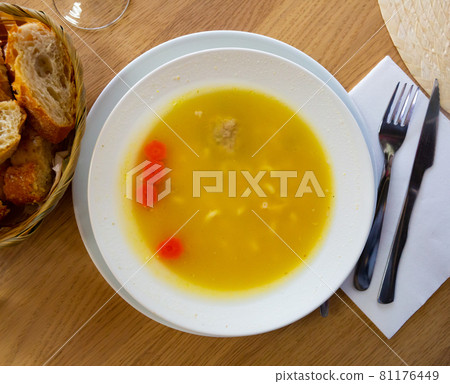 Traditional Catalan Escudella soup 81176449