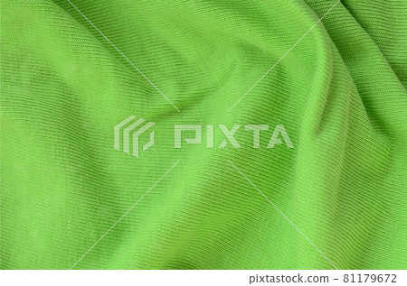 The texture of the fabric is bright green. Material for making shirts and blouses The texture of the fabric is bright green. Material for making shirts and blouses 81179672
