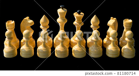 White wooden chess pieces isolated on black background. White wooden chess pieces isolated on black background. 81180714
