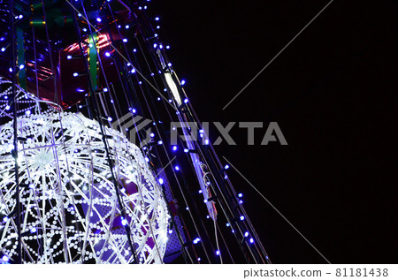 Fragment of the New Year tree. A lot of round lights of blue color are located on a conical frame 81181438