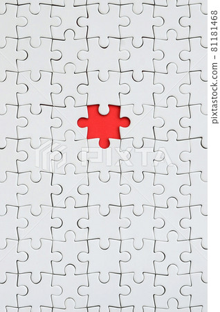 The texture of a white jigsaw puzzle in an assembled state with one missing element forming a red space The texture of a white jigsaw puzzle in an assembled state with one missing element forming a red space 81181468