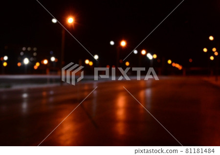 Blurred photo of school playground at night with bright lights 81181484