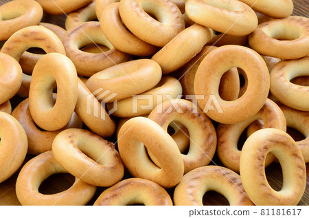 Close-up photo of fresh yellow bagels. A popular kind of flour products. One of the traditional Russian treats for tea Close-up photo of fresh yellow bagels. A popular kind of flour products. One of the traditional Russian treats for tea 81181617