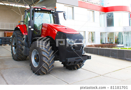 Red tractor at Kyiv, Ukraine 81181701