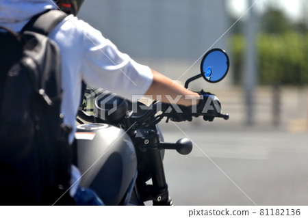 Image of a rider holding the steering wheel Image of a rider holding the steering wheel 81182136