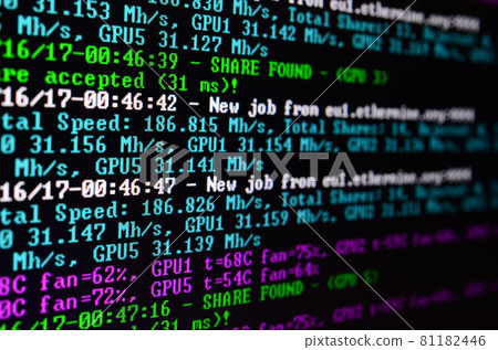 Macro snapshot of the program interface for crypto currency mining on the monitor of an office computer. The concept of mining bitcoins. The flow of information strings and data 81182446