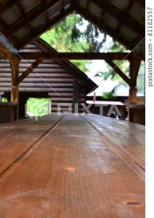 Interior of a wooden arbor handmade from dark wood in the woodland 81182557