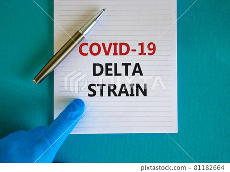 New covid-19 delta variant strain symbol. Hand in blue glove with white card. Concept words 'Covid-19 delta strain'. Metalic pen. Medical and COVID-19 delta variant strain concept. Copy space. 81182664