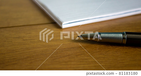 White notebook and pen on wood table. Business concept. 81183180