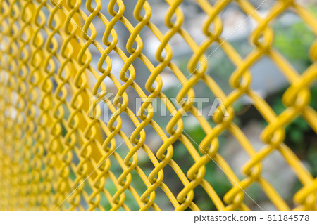 yellow wire fence close up yellow wire fence close up 81184578