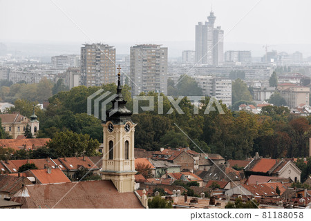 View of Zemun, with church bell tower and cityscape on background. Belgrade, Serbia 81188058