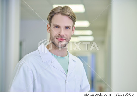 Tranquil attractive doctor posing for the camera in the workplace 81189509