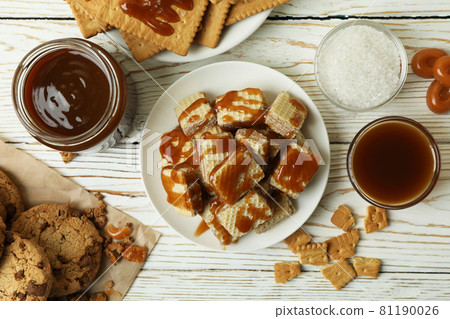 Tasty snack concept with cookies with caramel on white wooden table 81190026