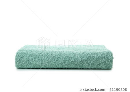 Green folded towel isolated on white background Green folded towel isolated on white background 81190808