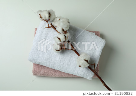 Clean folded towels and cotton on white background 81190822