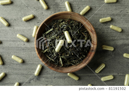 Concept of herbal medicine pills on gray textured background, top view Concept of herbal medicine pills on gray textured background, top view 81191502