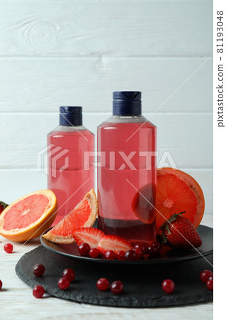 Natural shower gel and ingredients against white wooden background Natural shower gel and ingredients against white wooden background 81193048