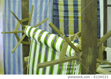 KUALA LUMPUR, MALAYSIA -JUNE 25, 2016: Traditional weaving machine operate by a Malay woman. Produced special cloth called Songket.  81194131