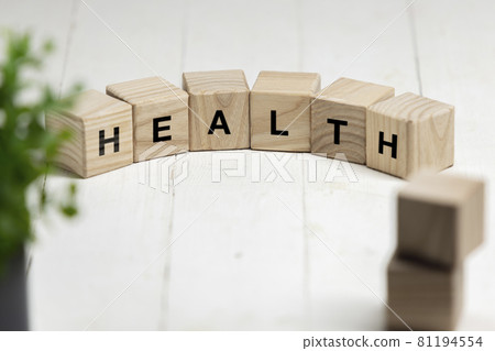 Six wooden cubes, blocks standing on table and showing word HEALTH. Conceptual image about human rights, education, social issues, mental health, education and personal development. 81194554