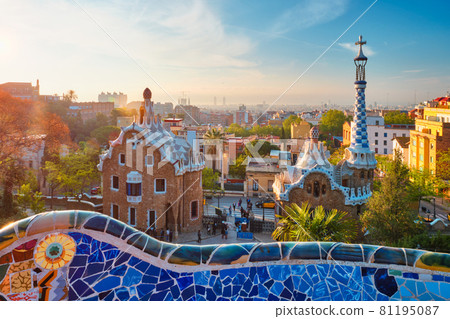 Barcelona city view from Guell Park. Sunrise view of colorful mosaic building in Park Guell 81195087