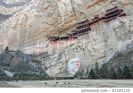 The Hanging Temple or Hanging Monastery near Datong in Shanxi Province, China. The Chinese characters mean "spectacular". Some ancient Chinese script is also visible. Hanging Temple with foreground. 81195120