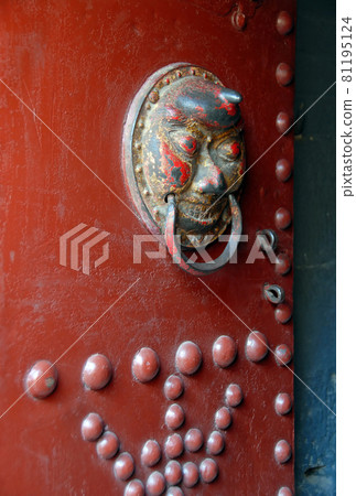 The Hanging Temple or Hanging Monastery near Datong in Shanxi Province, China. Detail of a red door at the Hanging Temple. 81195124