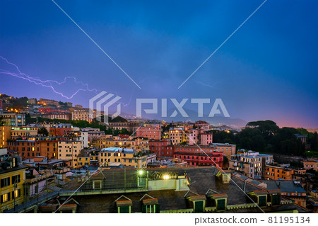 Evening view of Genoa Genova town in thunderstorm with lighting. Genoa, Italy 81195134