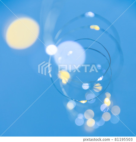 Texture of New Year or Christmas garland on a blue background. Abstract painting 81195503