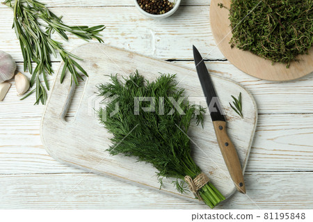Fresh herbs on white wooden background, top view Fresh herbs on white wooden background, top view 81195848