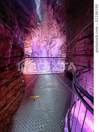 waterfall in cave with colored lights cascate del varone waterfall in cave with colored lights cascate del varone 81196198