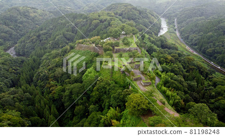 Drone aerial view of "Honmaru Ruins" at Oka Castle Ruins, Taketa City 81198248
