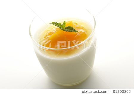 Photographed almond tofu with flesh-filled mango sauce on a white background 81200803